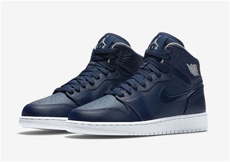 navy blue high top jordans.